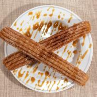 Churros (3 Pcs) · Fried dough pastries covered with cinnamon and sugar, filled with your preference flavor.