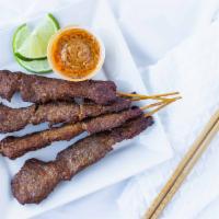 Satay · Grilled chicken or pork seasoned with spices on bamboo skewers. Served with cucumber salad a...