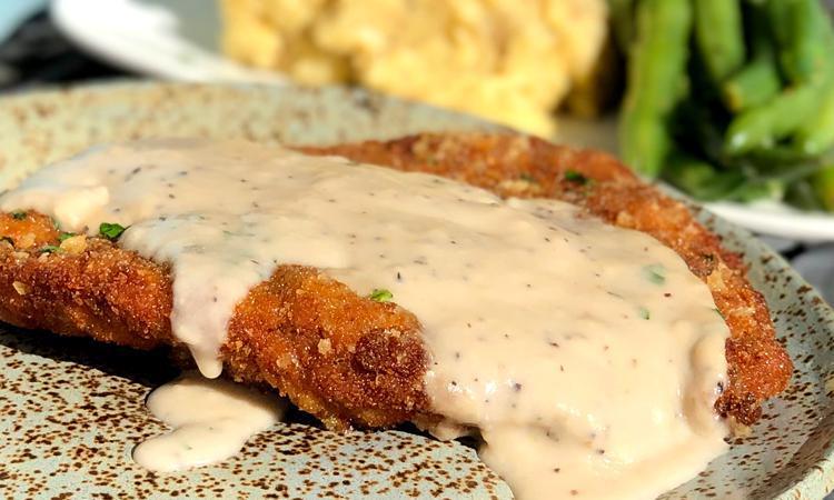 Chicken Fried Steak Blue Plate Special · Our Classic chicken fried steak, with a country-style cream gravy, roasted garlic mashed potatoes and steamed green beans