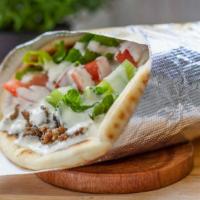 Gyro Wrap · Lamb thinly sliced and grilled with lettuce, tomato, cucumbers in pita bread. Includes signa...