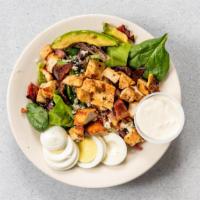 Cobb Salad · Chicken breast, hard-boiled egg, bacon, avocado, and tomatoes on iceberg lettuce topped with...