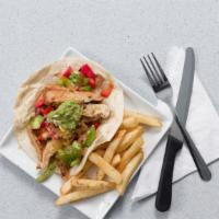 Tacos · Two veggie or chicken tacos on flour tortillas, with tomato, guacamole, served with black be...