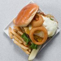 Starburger · Tall burger with American cheese, a fried egg, onion rings, lettuce, and tomato. *Consuming ...