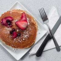 Star Cakes · Two huge buttermilk, chocolate chip, banana, or pecan pancakes served with fresh fruit.