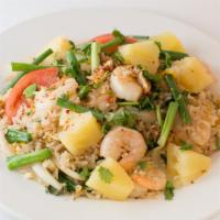 Pineapple Fried Rice · Stir fried Jasmine rice with Thai spice and fresh pineapple: choice of protein, egg, onion, ...