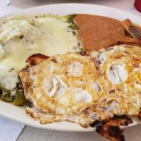 Chilaquiles · Regular chilaquiles. Served with refried beans and sour cream.