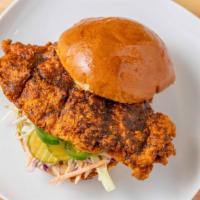 Nashville Hot Chicken Sandwich · Crispy chicken breast, coleslaw, candied jalapenos, pickles, and comeback sauce.