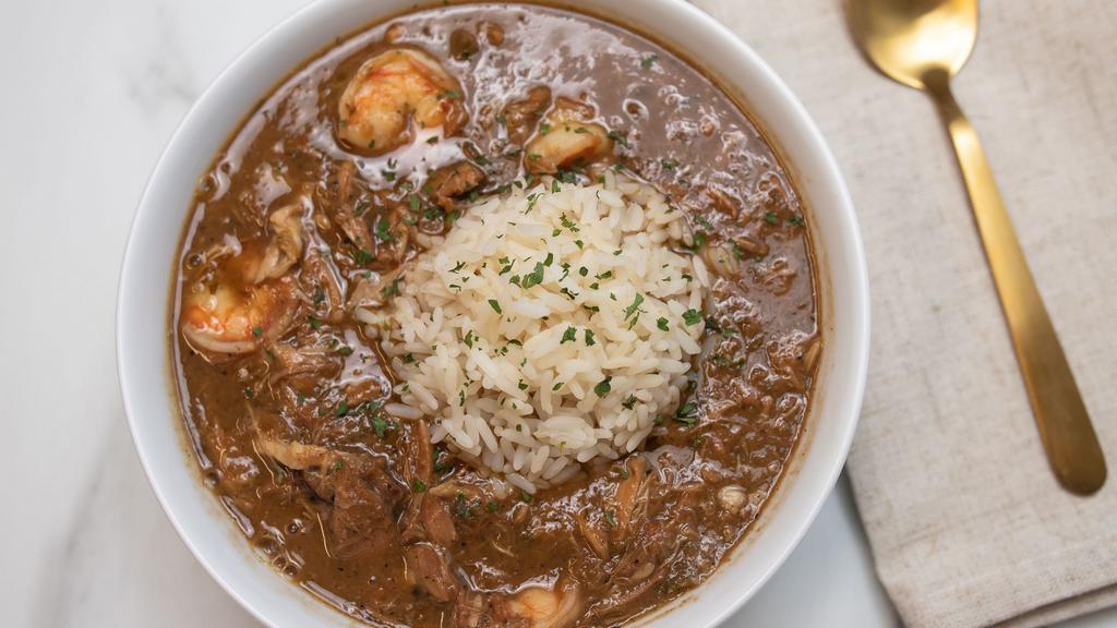 8 Oz Cup Gumbo Ala Nola · Original Louisiana style gumbo consisting of chicken, sausage, and shrimp served with rice and crackers.