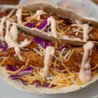 Fish Tacos · 2 tacos with lettuce, tomatoes, purple onions, purple cabbage, cheese and our homemade tarta...