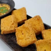 Fried Tofu · Deep-fried tofu served with sweet & sour sauce topped with ground peanuts.
