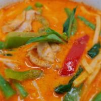 Red Curry · Spicy. Traditional Thai red curry paste with bamboo shoots, green bean, basil, bell pepper, ...