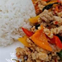 Pad Krapow · Spicy. Choice of chicken, Tofu, Beef  or shrimp, served with steamed rice. Stir fry meat wit...