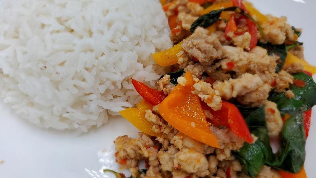 Pad Krapow · Spicy. Choice of chicken, Tofu, Beef  or shrimp, served with steamed rice. Stir fry meat with garlic, Thai chili, bell pepper, Thai basil, and hot spices.