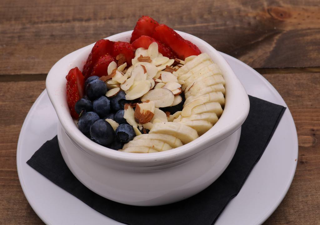 Steel Cut Oatmeal · Steel cut oats made with oat milk,
topped with brown sugar, fresh fruit, almonds.