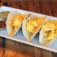 Jo'S Breakfast Tacos · 3 flour or corn tortillas, scrambled cage free
eggs, hashbrowns, jack & cheddar. Served
with...