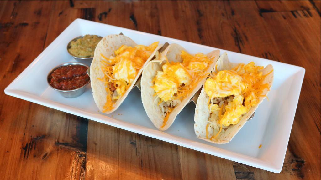 Jo'S Breakfast Tacos · 3 flour or corn tortillas, scrambled cage free
eggs, hashbrowns, jack & cheddar. Served
with fresh salsa, cilantro jalapeno sauce.
Add veggies 1 each, meats 1.5/2 each,
avocado 1.5,