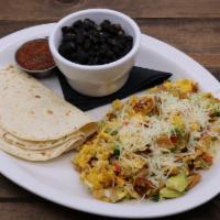 Migas · Scrambled cage free eggs, tortilla strips, cho-
rizo, jalapenos, onions, tomatoes, cheese, a...