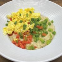 Puttin' On The Grits · A generous portion of our sumptuous home-
made smoked gouda grits topped with your

choice o...