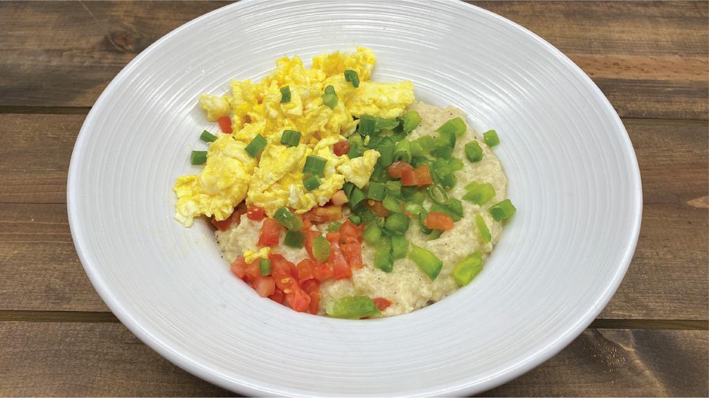Puttin' On The Grits · A generous portion of our sumptuous home-
made smoked gouda grits topped with your

choice of 2 veggies or meats*, two cage free
eggs any style, garnished with scallions.
Extra veggies 1 each, meats 1.5/2 each,
avocado 1.5.