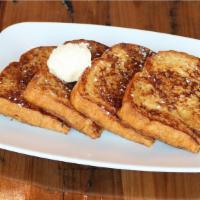 Petit Caramelized Brioche French Toast · Vegetarian. Sugar dusted brioche served with whipped butter.