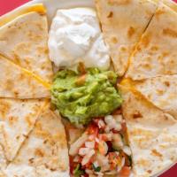 Quesadilla Plate · One small cheese quesadilla on flour served with rice and refried beans.