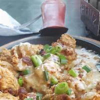 Tots · House made jalapeno and cheddar cheese tots, lightly beaded and fried, drizzled with queso a...