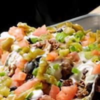 Pulled Pork Nachos · Our house smoked pulled pork, BBQ sauce, house queso, jalapenos, green onions, black beans, ...