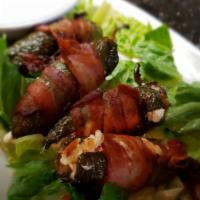 Stuffed Jalapenos · Bacon wrapped grilled jalapenos stuffed with smoked cream cheese.