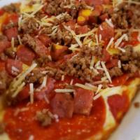 Carnivore Flatbread · Pepperoni, seasoned beef, jalapeno sausage, bacon, mozzarella cheese, and tomato sauce.