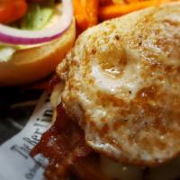 Barnyard Burger · Burger topped with jack cheese, crispy bacon, fried egg, and chipotle mayo. With lettuce, to...