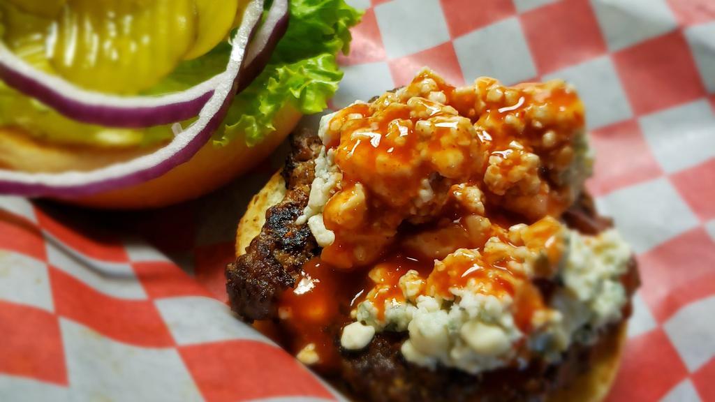 Black & Bleu Burger · Blackened burger topped with bleu cheese crumbles, spicy cajun wing sauce and chipotle mayo. With lettuce, tomato, pickles, and onion.