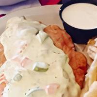 Chicken Fried Chicken · Hand breaded chicken breast, fried and topped with our homemade jalapeno cream gravy. Served...