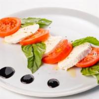 Caprese · Fresh tomatoes, fresh mozzarella, fresh basil, and topped with balsamic reduction.
