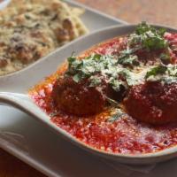 Italian Meatballs · Hand rolled with a melted mozzarella center, topped with zesty marinara and basil.  Served w...
