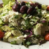 Greek (Half) · Romaine, red cabbage, red leaf lettuce, feta, cucumber, roasted artichokes, oregano, green o...
