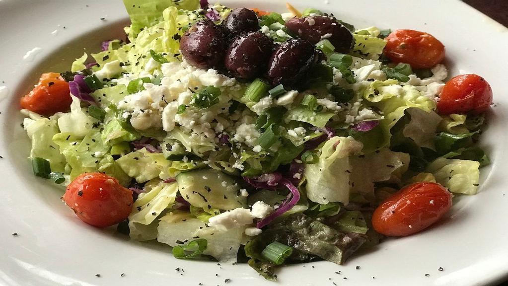 Greek (Half) · Romaine, red cabbage, red leaf lettuce, cucumber, roasted artichokes, grape tomatoes, feta, green onions, kalamata olives, oregano, housemade red wine vinaigrette.