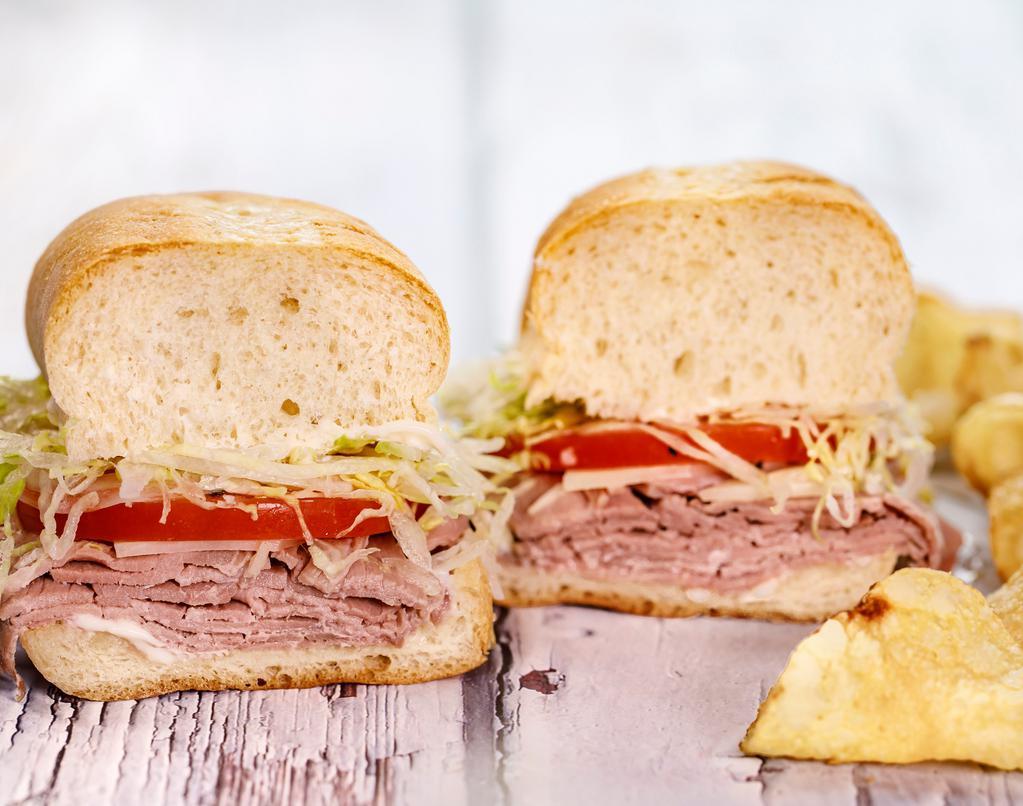 Roast Beef & Provolone (Full) · With chips. Roasted beef, provolone, lettuce, tomato, onion, mayo, red wine vingar & olive oil.