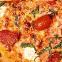 Margherita · Red sauce, fresh mozzarella, basil, grape tomatoes, spin blend cheese.