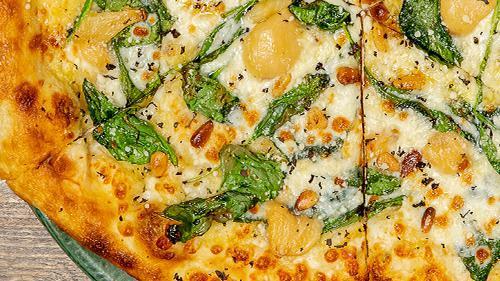 Spinach & Garlic · Herbed olive oil, spinach, roasted garlic cloves, pine nuts, spin blend cheese.