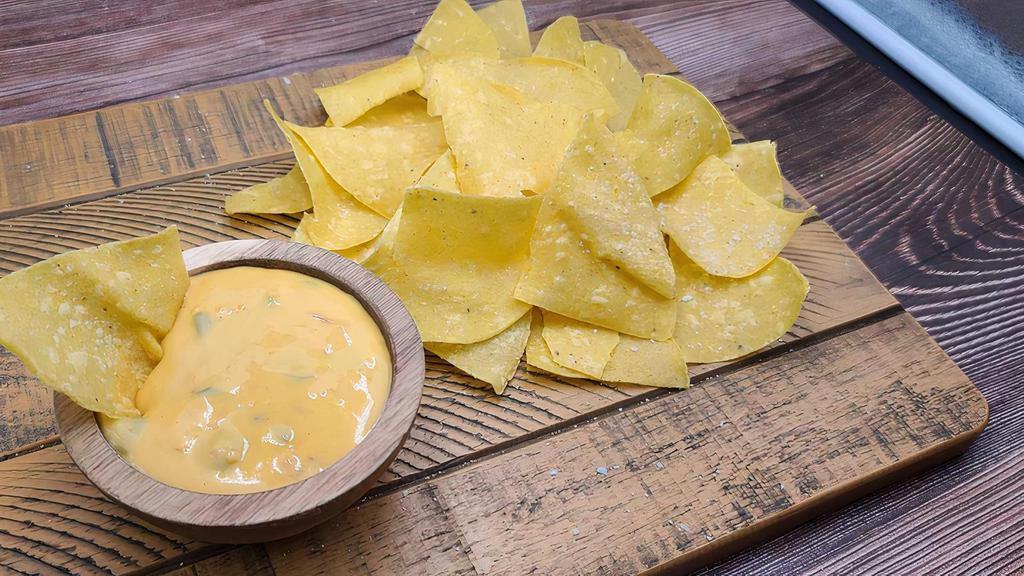 Regular Queso · FEEDS 6 - 8 PEOPLE. INCLUDES CHIPS.