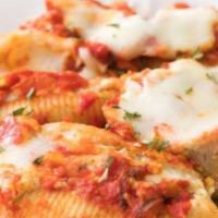 Stuffed Shells · Stuffed with ricotta cheese and baked with marinara sauce. Includes salad and two garlic rol...