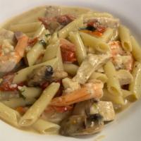 Spicy Chicken And Shrimp · Sautéed with penne pasta in a creamy parmigiana sauce with cayenne peppers, mushrooms, and s...
