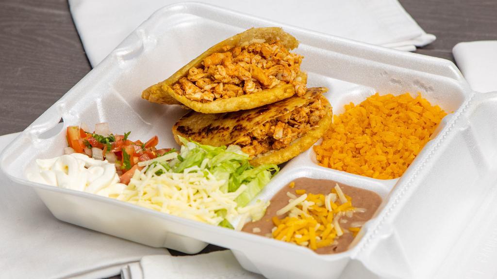 Gordita Plate · Two gorditas with your choice of meat served with rice, beans, lettuce cheese, pico de gallo and sour cream.