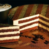 Cappuccino Cake · Alternating layers of espresso drenched chocolate sponge cake and coffee cream, decorated wi...
