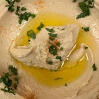 Hummus · The  famous mashed  chickpea mixture  with fresh lemon juice, tahini sauce and garnished wit...