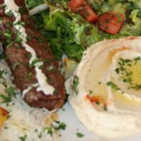 Mixed Kabab · Tow skews of chicken and kafta, serve with tahini sauce and garlic.