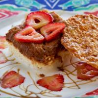 Tres Leches With Fresh Strawberries · Traditional Mexican cake soaked with three sweet creams and served with fresh strawberries a...