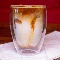 Caramel Macchiato · A layered drink with Vanilla at the bottom of the steamed milk with the shots of Espresso an...