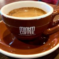 Cubano · Two shots of espresso with raw sugar infused in the brewing process to give it a bit of a ki...