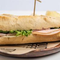 Turkey Baguette · Turkey, Provolone Cheese, Lettuce, and Mayo on a Baguette.